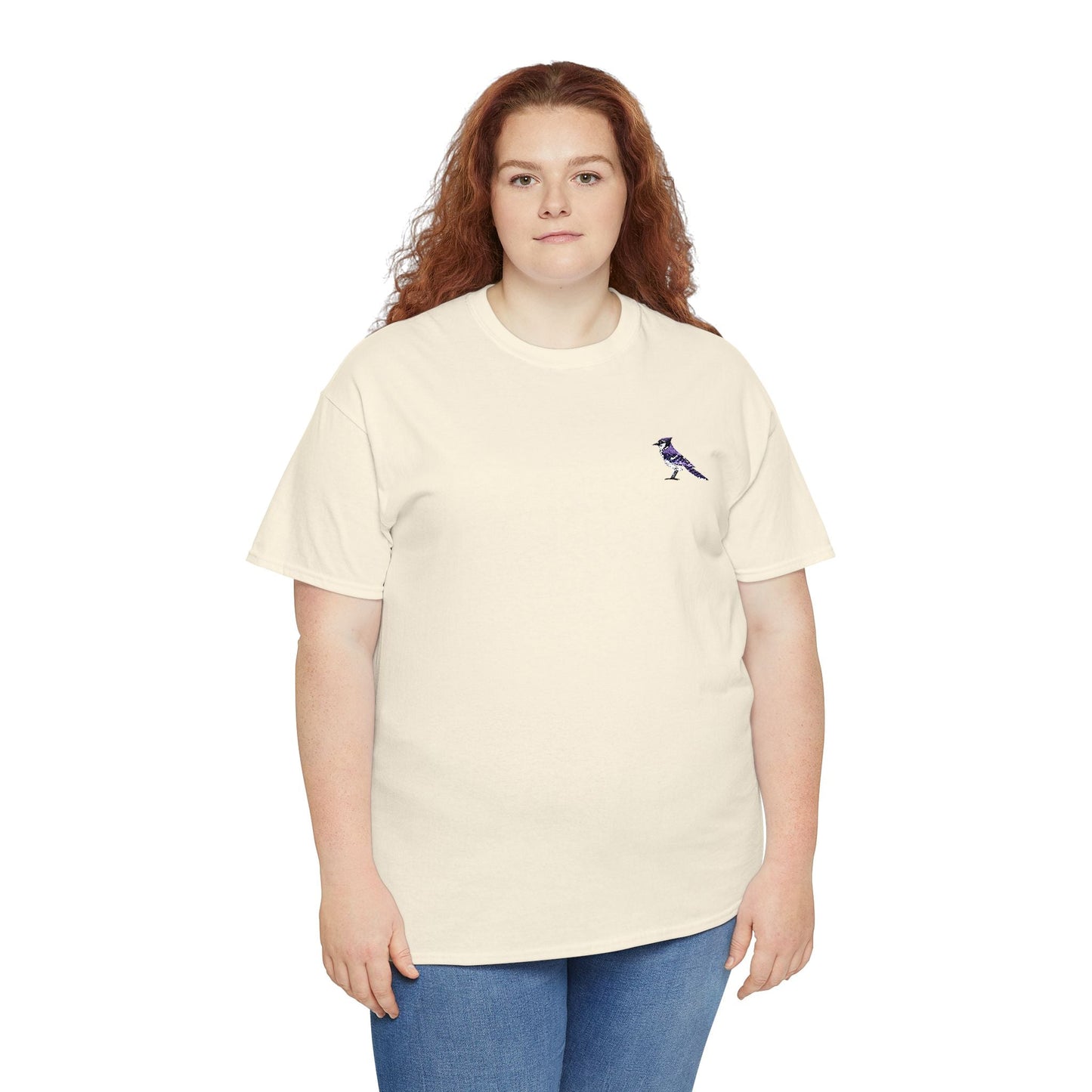 Person wearing a beige t-shirt with a small graphic on a white background