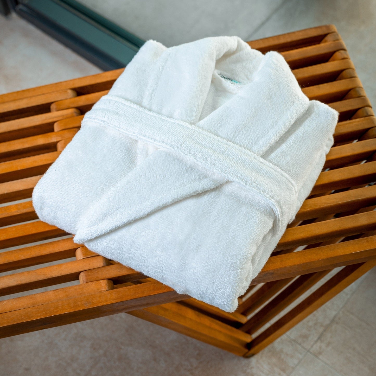 Luxury Organic Bathrobe Folded on a Gym Bench The Perfect Sustainable Present - ShopPurpleUmbrella