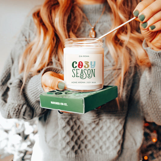 Cozy Season Candle Being Lit