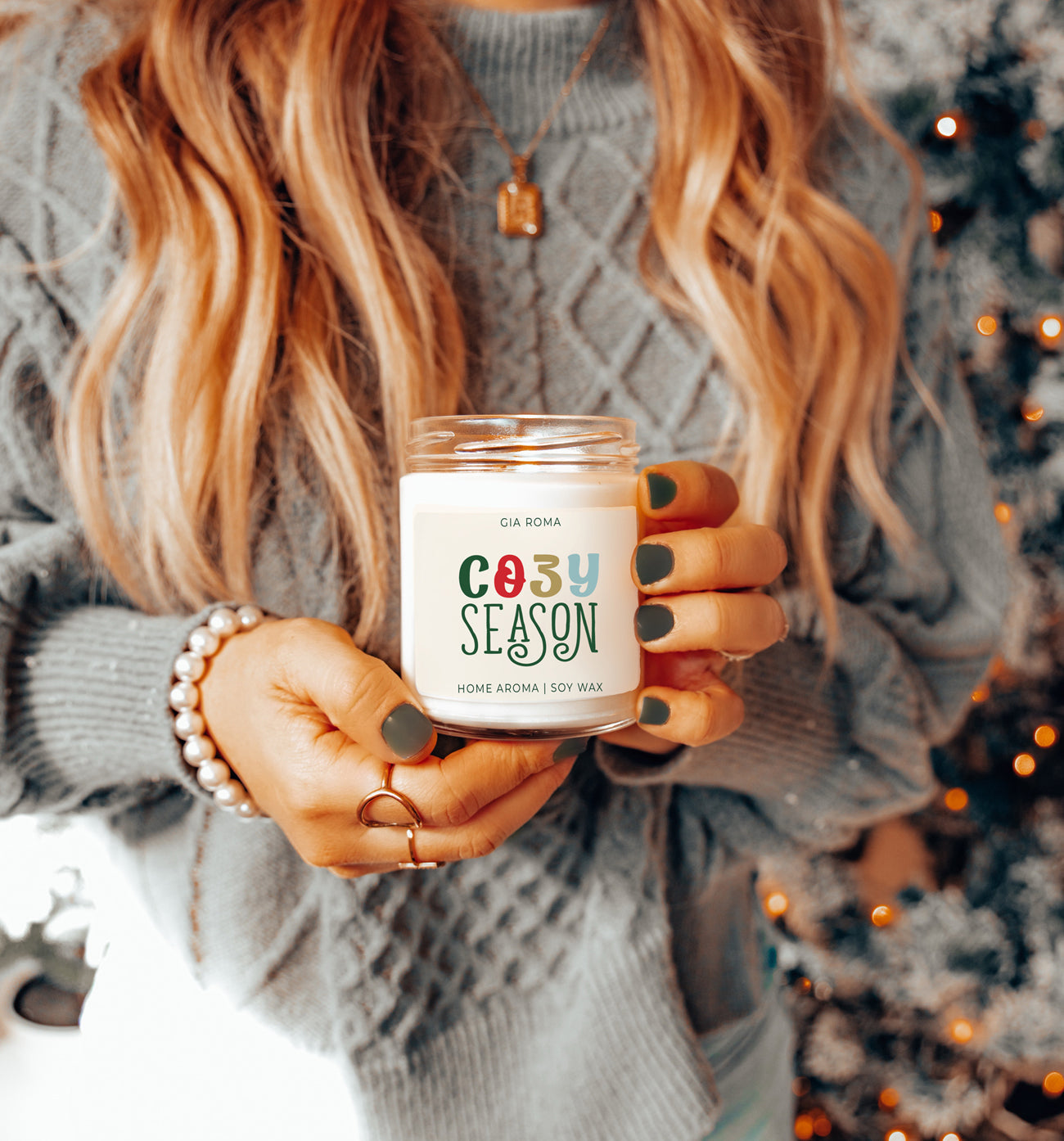 Cozy Season Candle Being Held in a Woman's Hands 