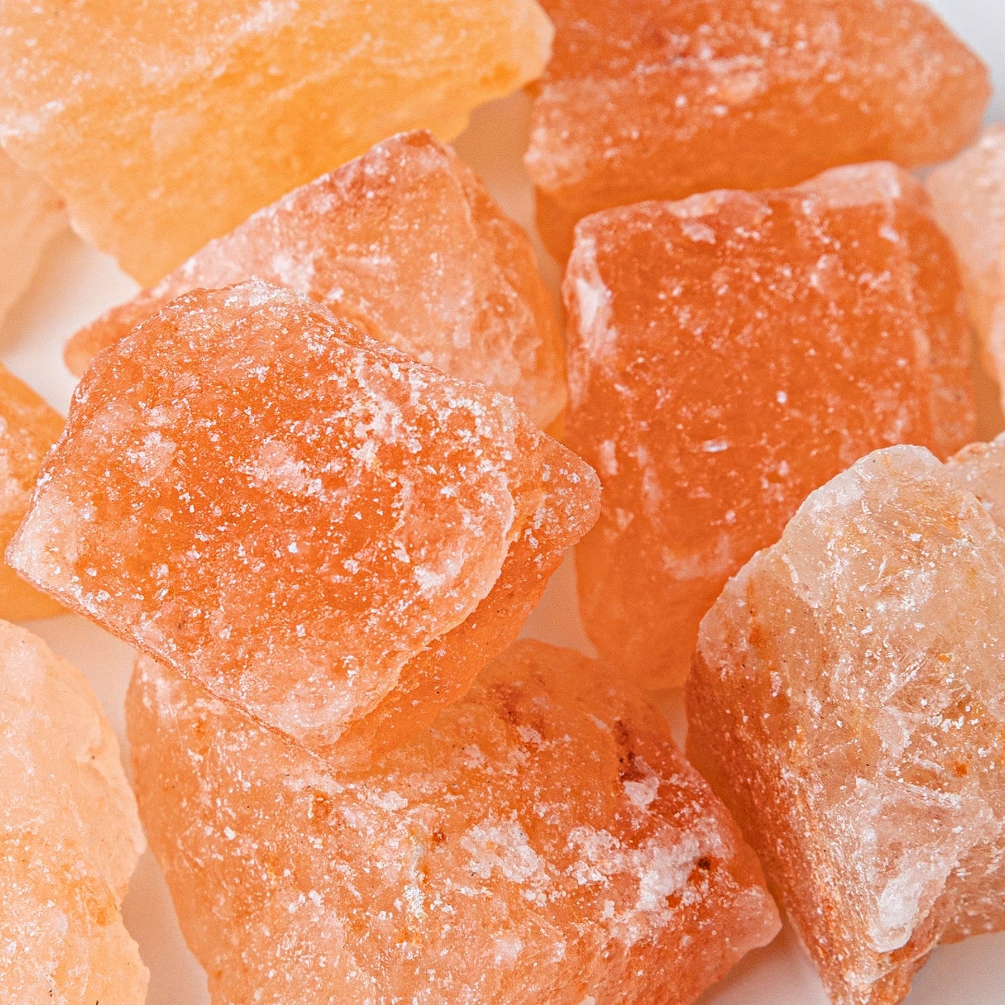 Close-up of orange crystallized ginger pieces.
