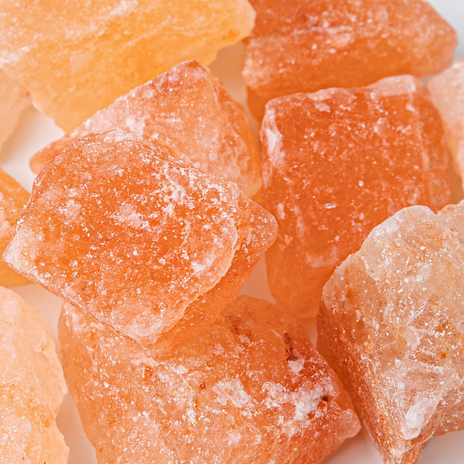 Close-up of orange crystallized ginger pieces.