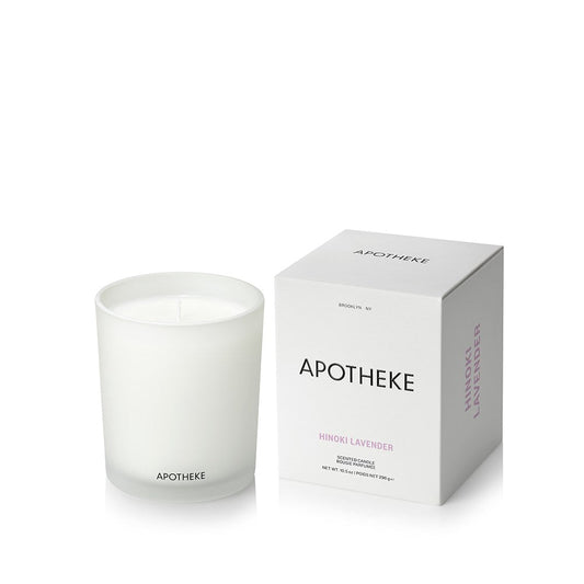 Apotheke candle and its packaging on a white background