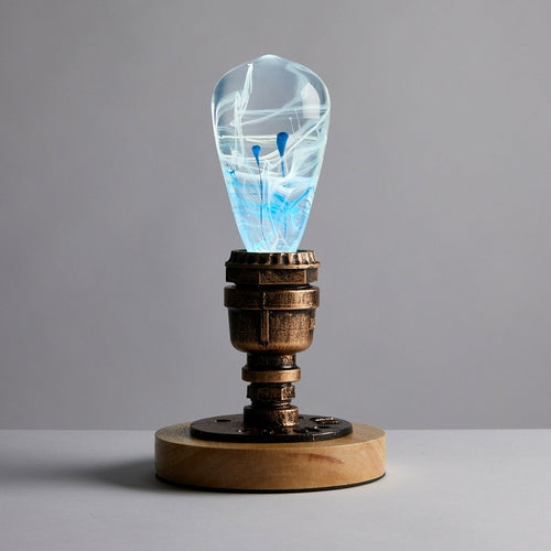 Decorative light bulb with a wooden base on a gray background