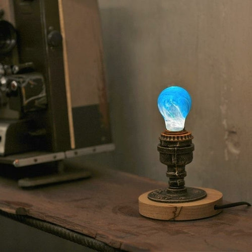 Decorative light bulb on a wooden base with a vintage background