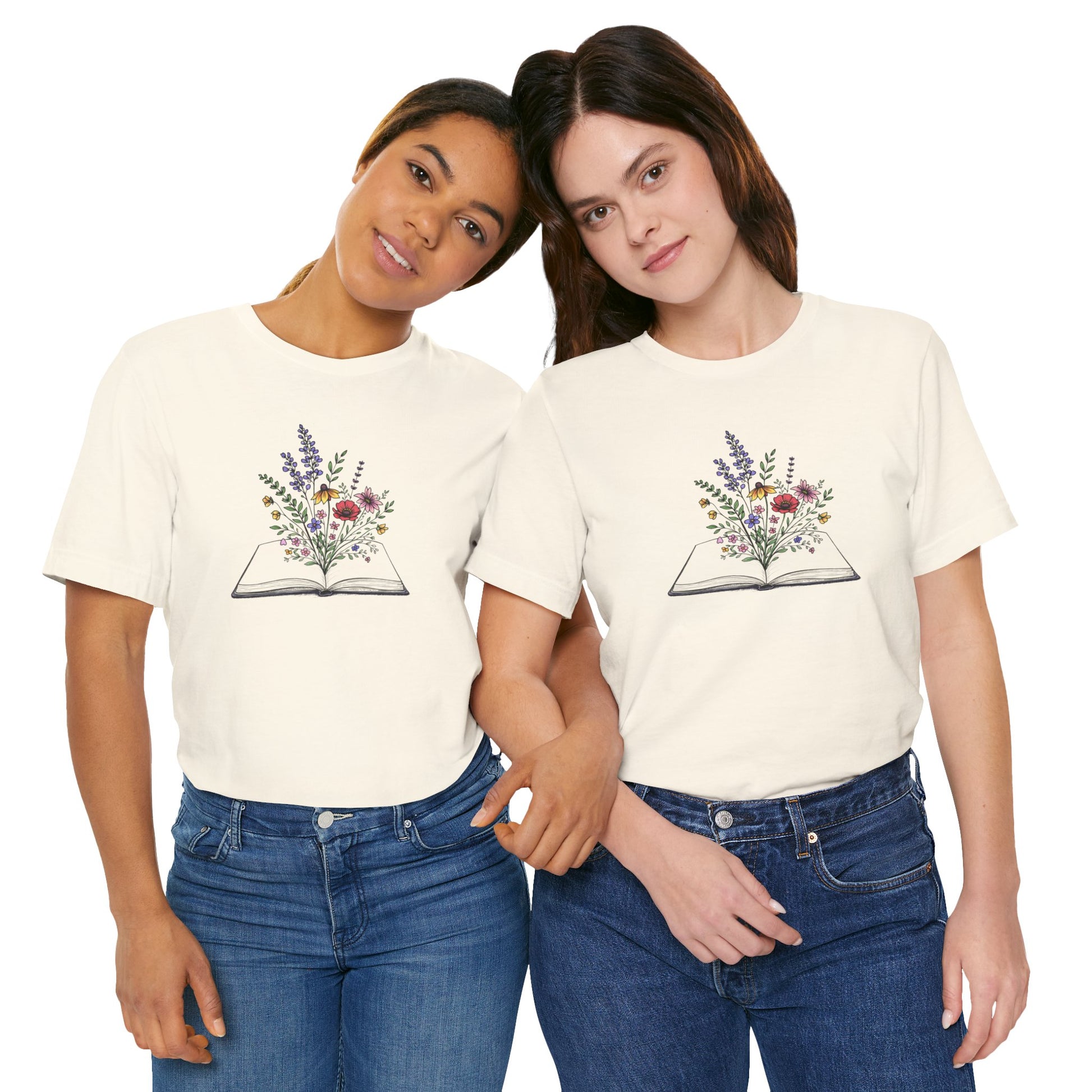 Two people wearing cream t-shirts with a floral book design on a white background