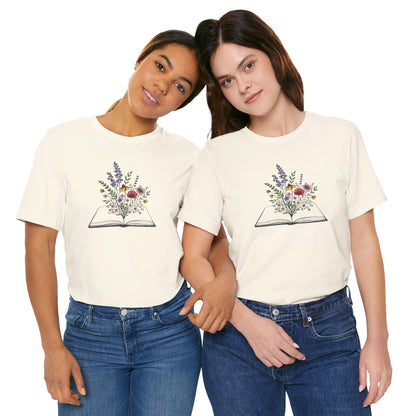 Two people wearing cream t-shirts with a floral book design on a white background