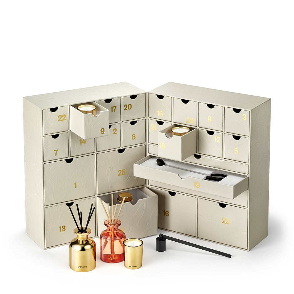 APOTHEKE candle advent calendar with numbered drawers open to show candles and a reed diffuser