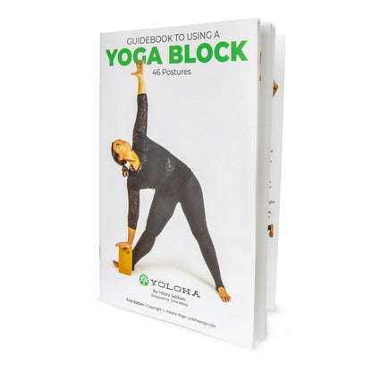 Book titled 'Guidebook to Using a Yoga Block' by Yoloha on a white background