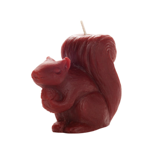 Red beeswax squirrel candle with a tufted tail and cotton wick