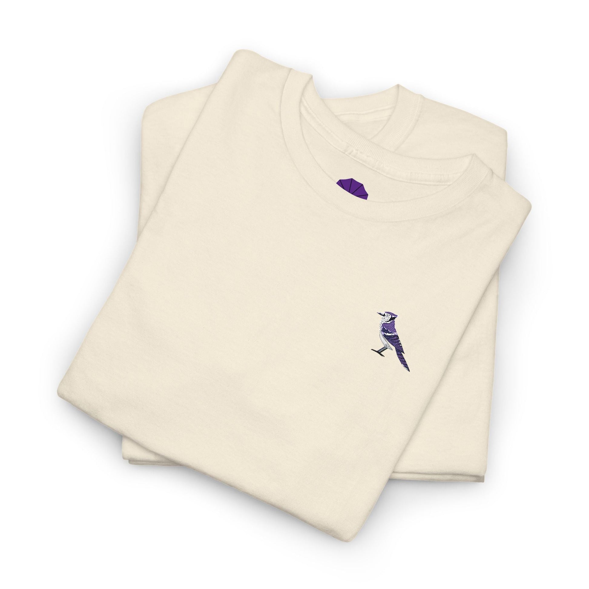 Folded beige sweatshirt with a purple logo on a white background