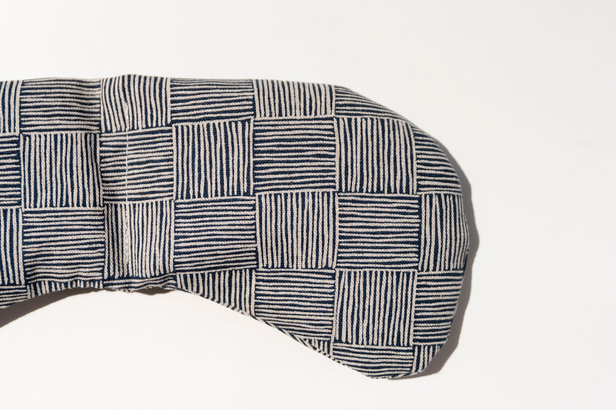Close-up of the navy crosshatch Haystack print on the eye mask