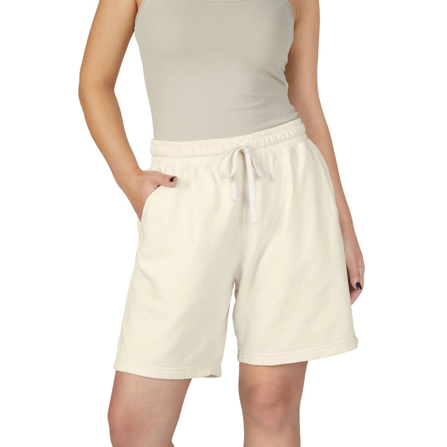 Person wearing ivory boyfriend shorts with a white drawstring on a white background