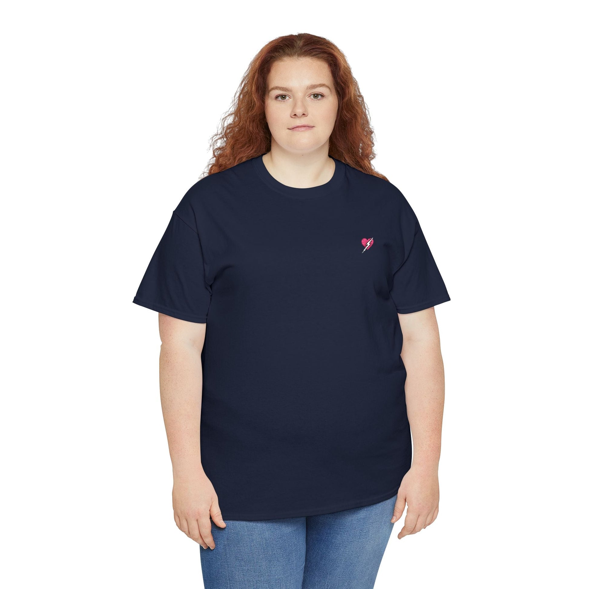 Person wearing a navy blue t-shirt with a small red heart logo on a white background