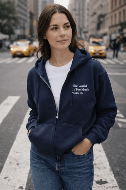 Model on New York City Street wearing embroidered navy blue zip up hoodie with Wordsworth Quote
