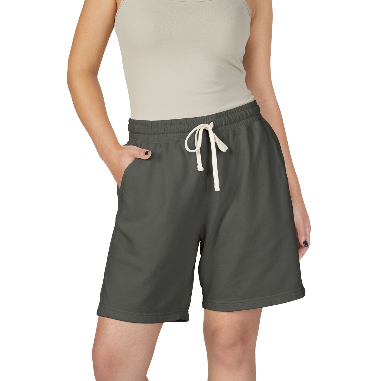 Person wearing pepper shorts with a white drawstring on a white background