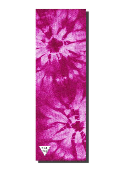 Pink and purple tie-dye yoga mat with a visible brand logo on a white background