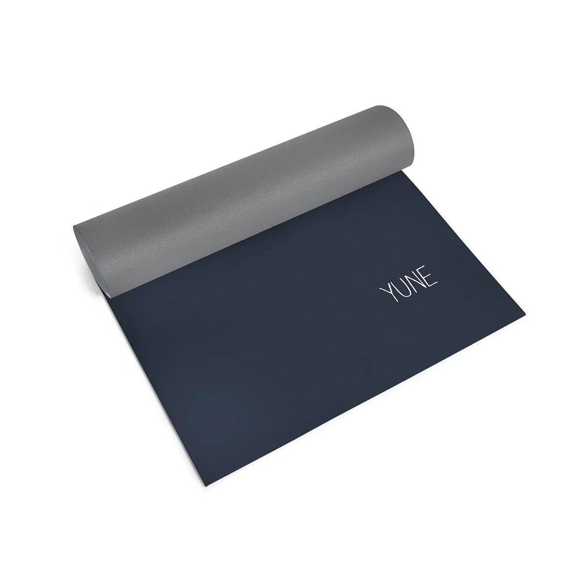 Yoga mat with gray top and dark blue bottom on a white background